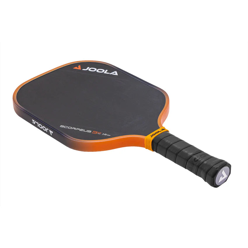 A JOOLA pickleball paddle with a black surface and orange accents, featuring a long handle and a grip in the middle.