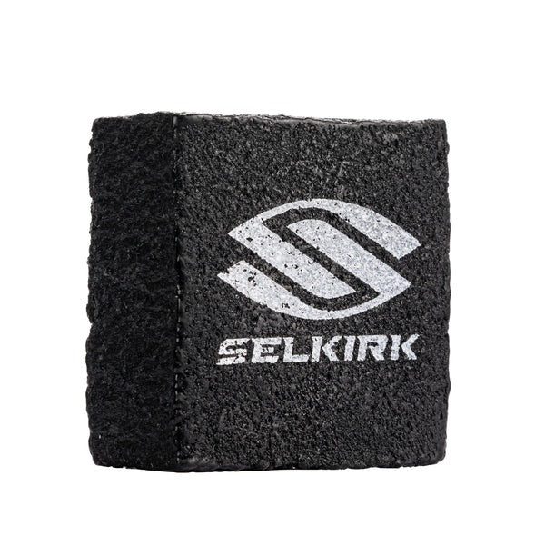 Black cleaning block with Selkirk logo on a white background