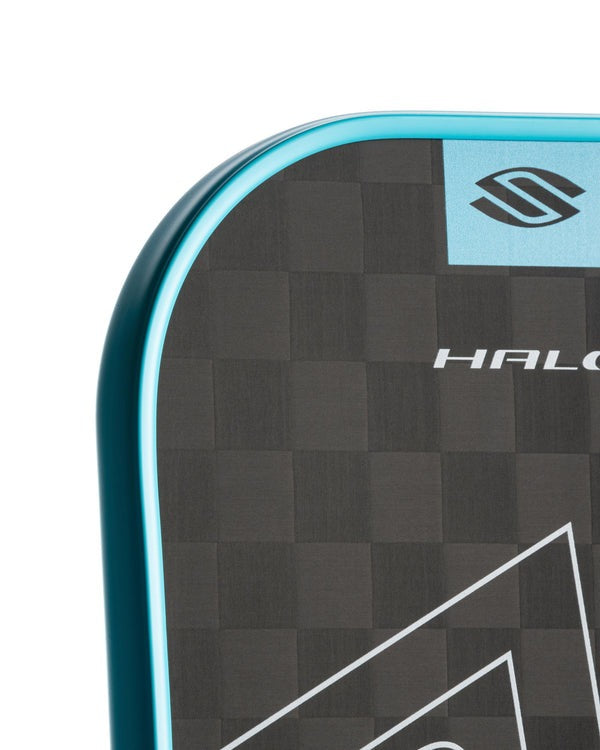 Close-up of a paddle with a checkered pattern and 'HALO' branding on a white background