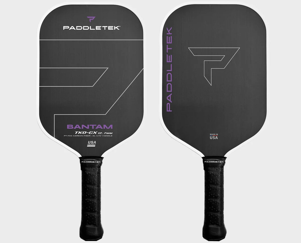 Two Paddletek Bantam TKO-CX pickleball paddles, one with a black base and red detailing, and the other with a red base and black detailing. Both feature the Paddletek logo and the name 'Bantam' on the surface.