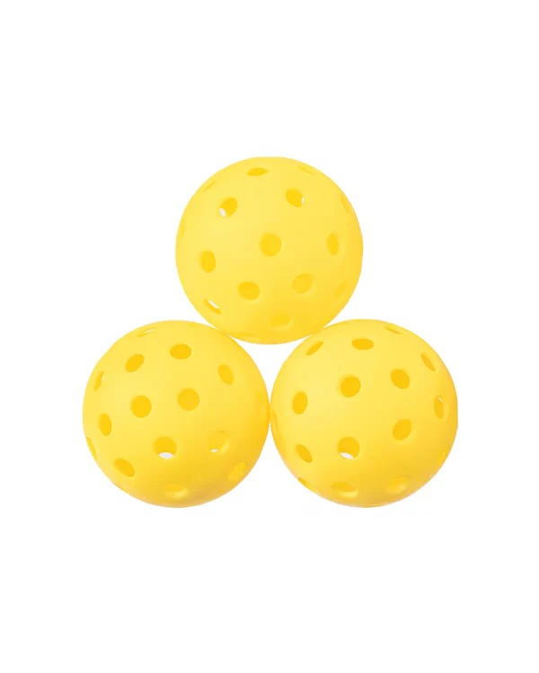 Three yellow perforated balls on a white background