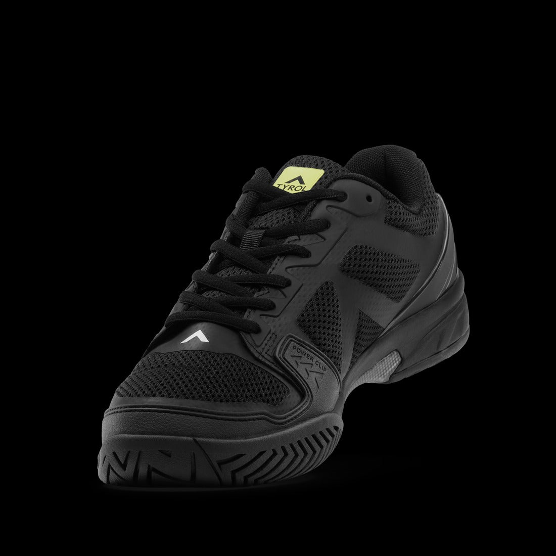 Black athletic shoe with a brand logo on a black background