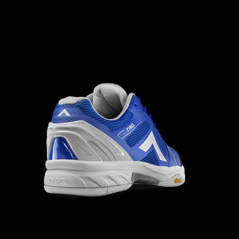 Blue and white athletic shoe on a black background