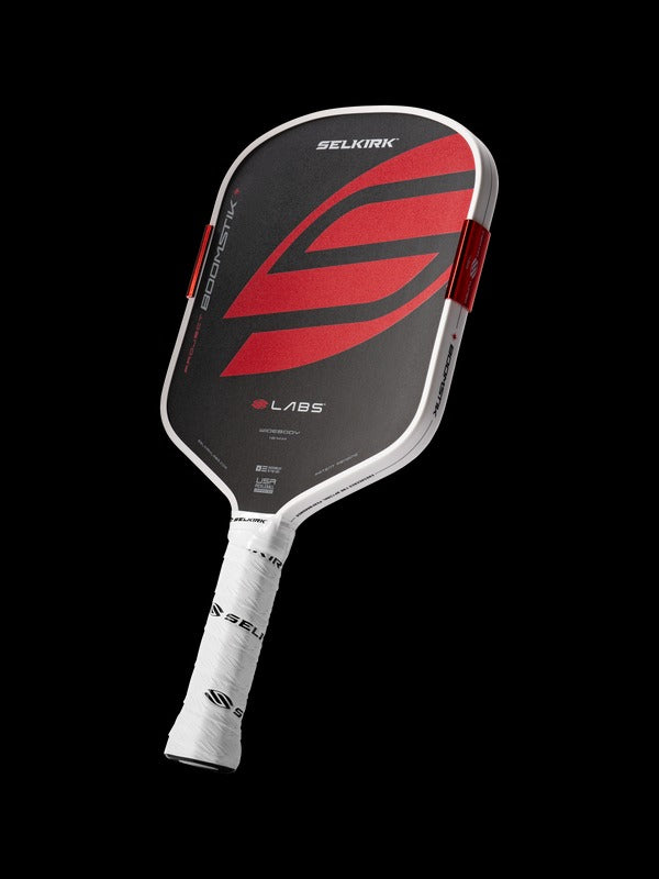 Pickleball paddle with red and black design on a white background