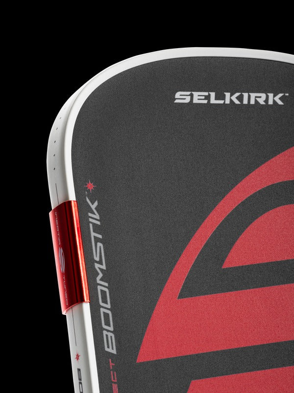 Close-up of a Selkirk product with red and black design on a black background