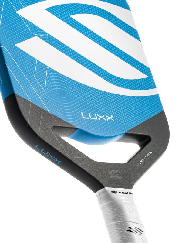 Close-up of a blue and gray pickleball paddle with 'LUXX' branding on a white background.
