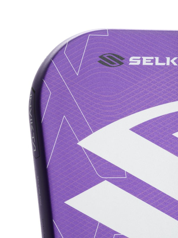Close-up of a purple sports equipment with 'Selk' branding on a white background