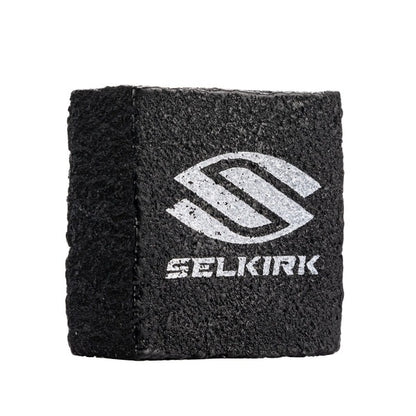 Black cleaning block with Selkirk logo on a white background