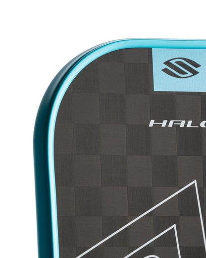 Close-up of a paddle with a checkered pattern and 'HALO' branding on a white background
