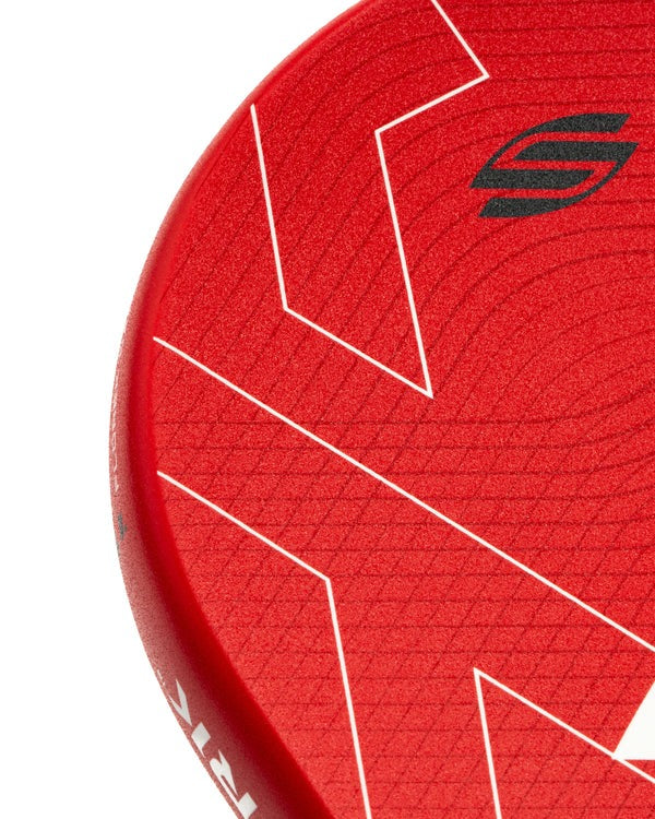 Close-up of a red sports paddle with a brand logo on a white background