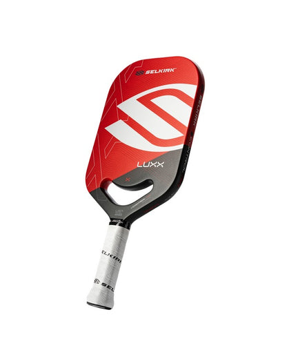 Red and black Selkirk Luxx paddle on a white background