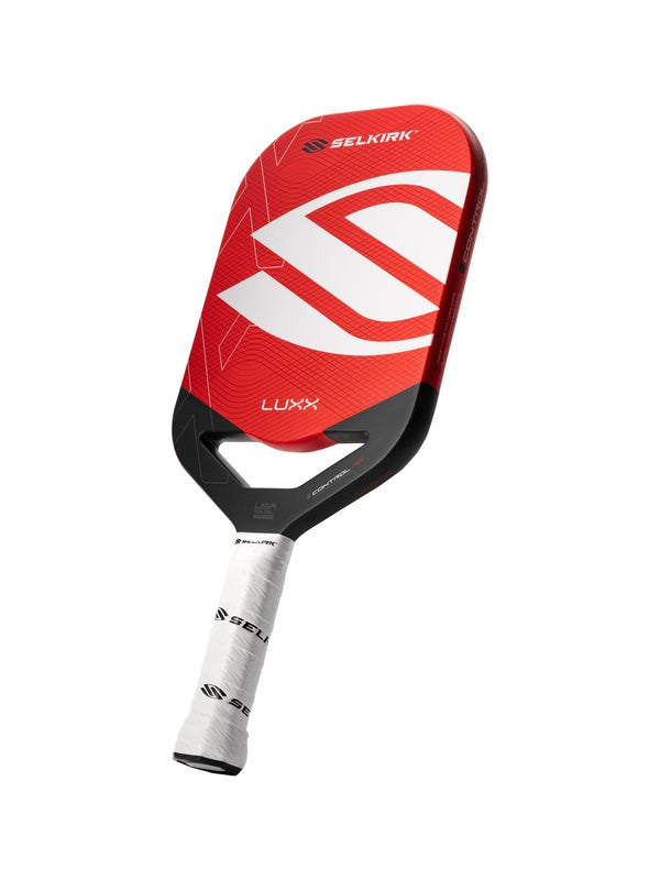 Red and black Selkirk Luxx paddle on a white background