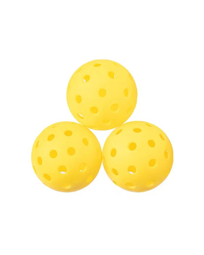 Three yellow perforated balls on a white background