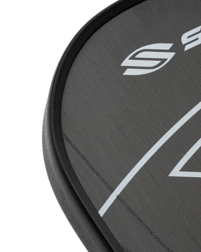 Close-up of a black paddle with a logo on a white background
