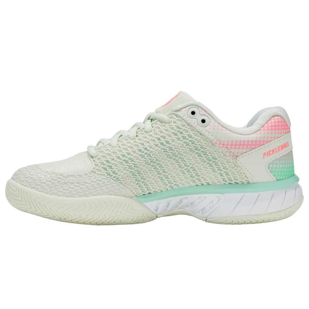 Light green athletic shoe with pink accents on a white background