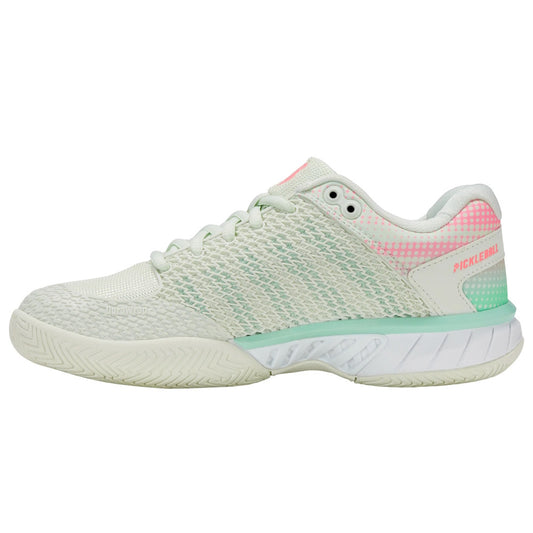Light green athletic shoe with pink accents on a white background