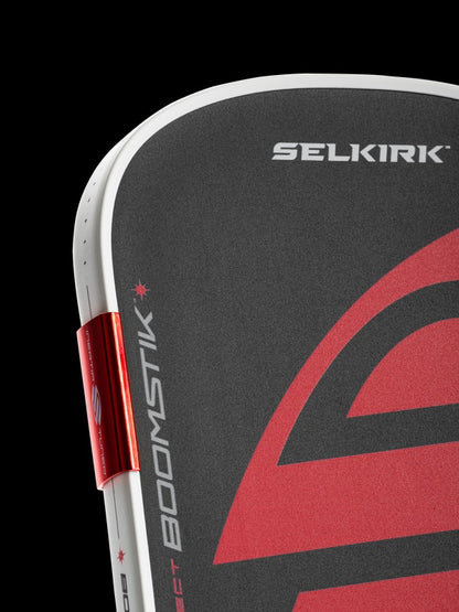 Close-up of a Selkirk product with red and black design on a black background