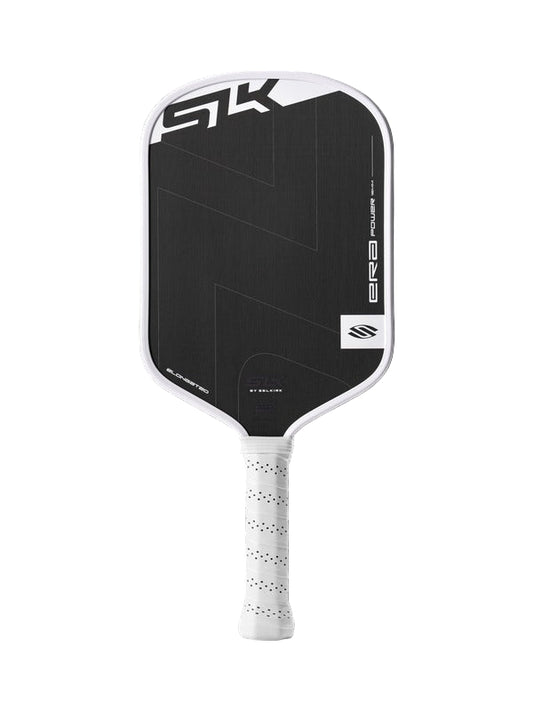 Pickleball paddle with black face and white handle on a black background