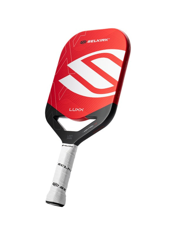 Red and black Selkirk pickleball paddle on a white background