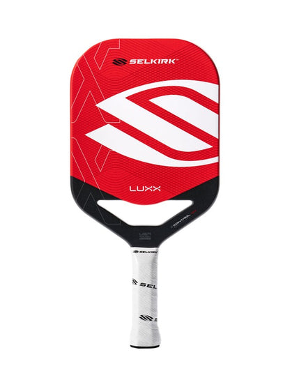 Red and black Selkirk Luxx pickleball paddle on a white background
