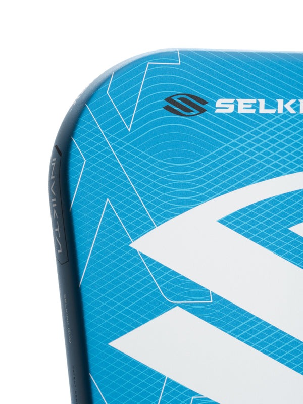 Close-up of a blue and white sports equipment with Selkirk branding on a white background