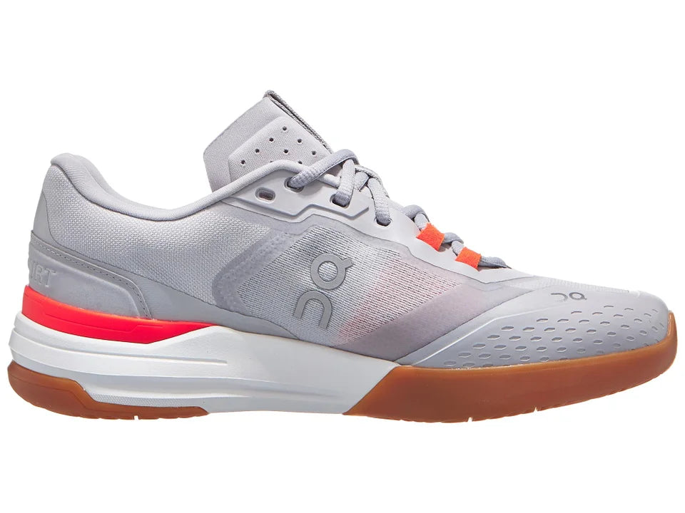 Gray athletic shoe with red accent on a white background