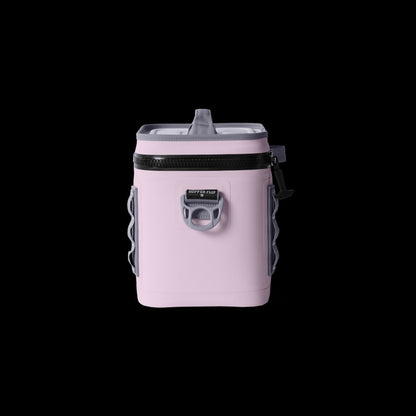 Pink insulated cooler bag with black zipper on a white background