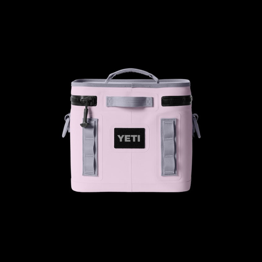 Pink YETI cooler bag on a black background