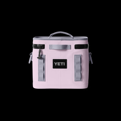 Pink YETI cooler bag on a black background