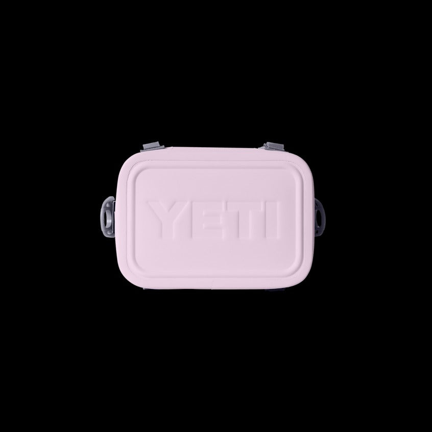 Pink YETI cooler bag on a black background