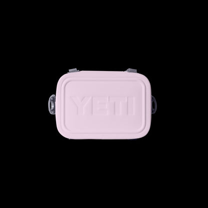 Pink YETI cooler bag on a black background